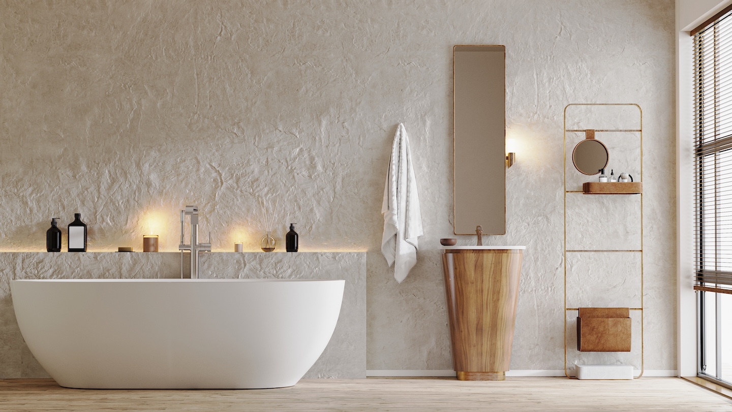 A serene spa-inspired bathroom with a freestanding soaking tub, warm wood accents, textured walls, and ambient lighting for relaxation.